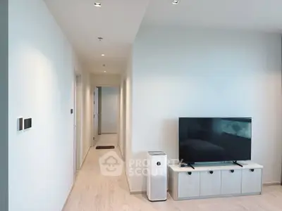 Modern living room with sleek TV setup and minimalist decor