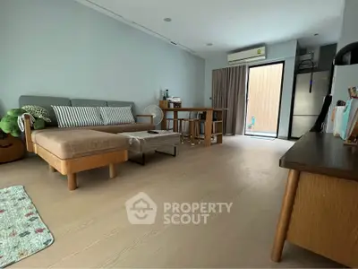 Spacious living room with modern furniture and natural light