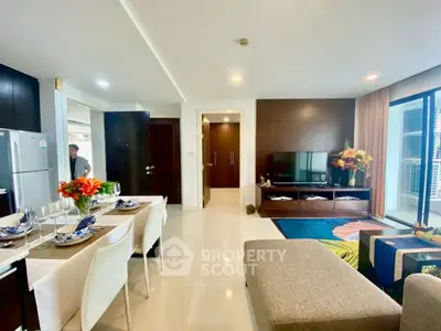 Spacious modern living room with open kitchen and elegant decor