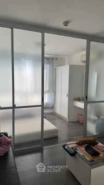 Modern bedroom with sliding glass doors and minimalist decor