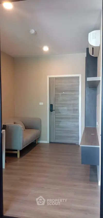 Modern living room with sleek design and cozy sofa