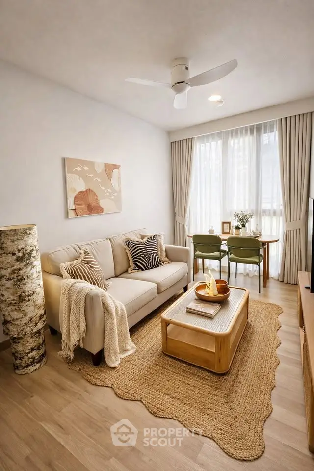 Cozy living room with stylish decor, natural light, and comfortable seating, perfect for relaxation.