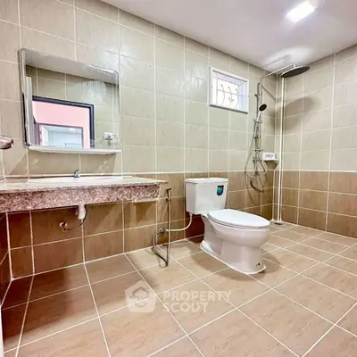 Modern bathroom with sleek fixtures and neutral tile design