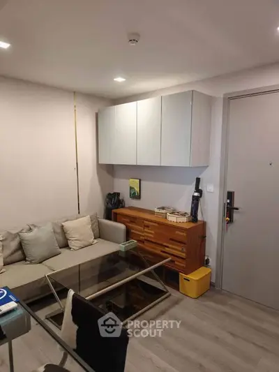 Modern living room with sleek furniture and minimalist design, perfect for urban living.