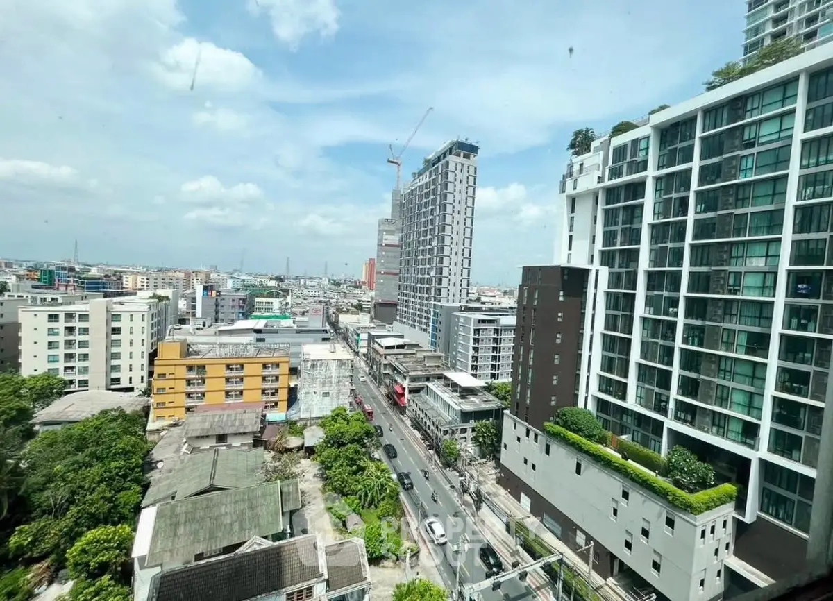 Stunning cityscape view from high-rise building showcasing urban living and modern architecture.
