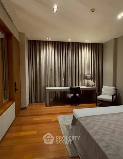 Luxurious bedroom with elegant decor and wooden flooring