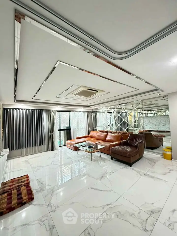 Luxurious living room with marble flooring and modern leather sofa