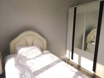 Cozy bedroom with modern wardrobe and elegant bed design