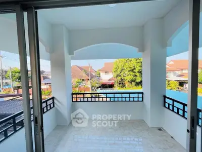 Spacious balcony with scenic neighborhood view, perfect for relaxation and outdoor enjoyment.