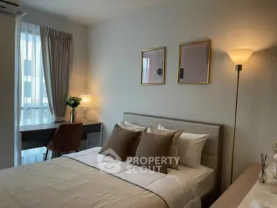 Cozy bedroom with elegant decor, featuring a comfortable bed, stylish desk, and warm lighting.