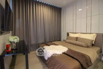 Luxurious modern bedroom with elegant decor and plush bedding