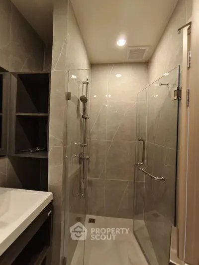 Modern bathroom with glass shower enclosure and sleek design