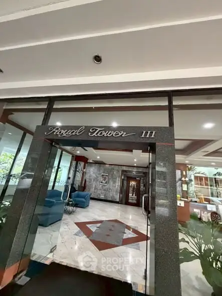 Elegant entrance of Royal Tower III with modern design and luxurious lobby area.