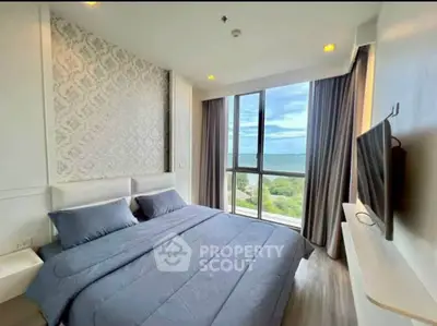 Luxurious bedroom with stunning ocean view and modern decor