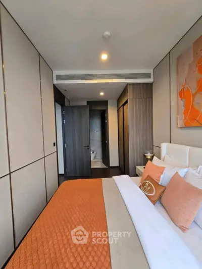 Modern bedroom with stylish decor and ensuite bathroom access