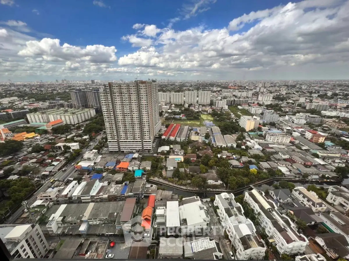 Stunning cityscape view showcasing high-rise buildings and sprawling urban landscape under a vibrant sky.