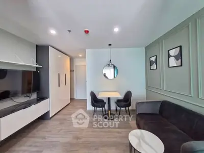 Modern living room with sleek furniture and stylish decor in a contemporary apartment.