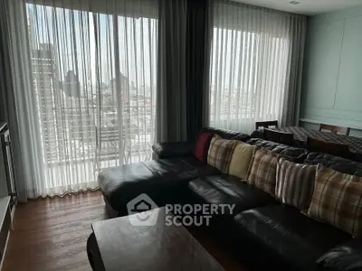 Spacious living room with city view and stylish decor