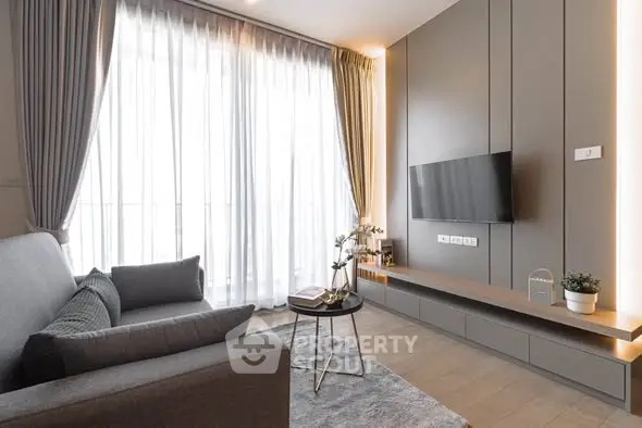 Modern living room with sleek design, large window, and stylish furniture.