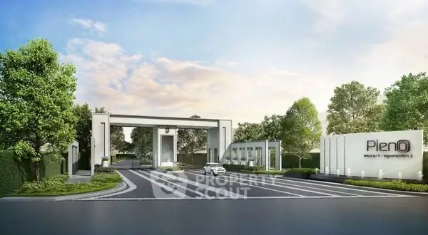 Modern residential entrance with sleek design and lush greenery, perfect for upscale living.