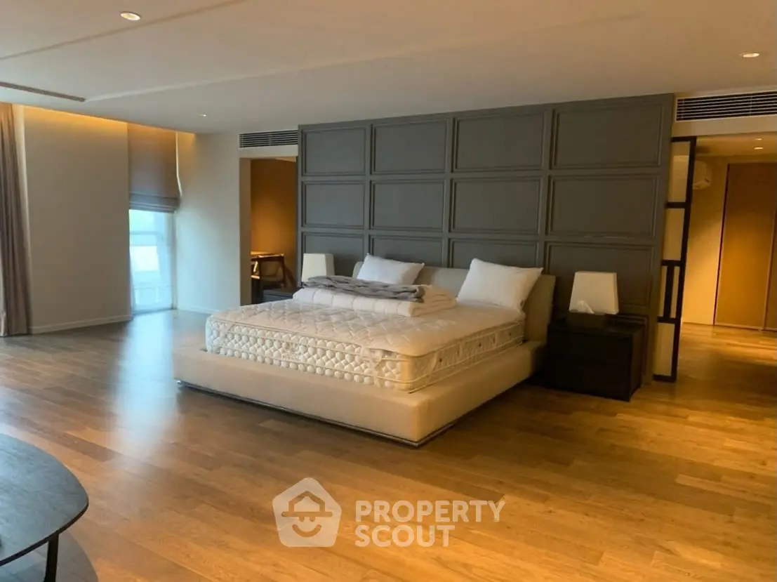 Luxurious modern bedroom with elegant wooden flooring and stylish decor