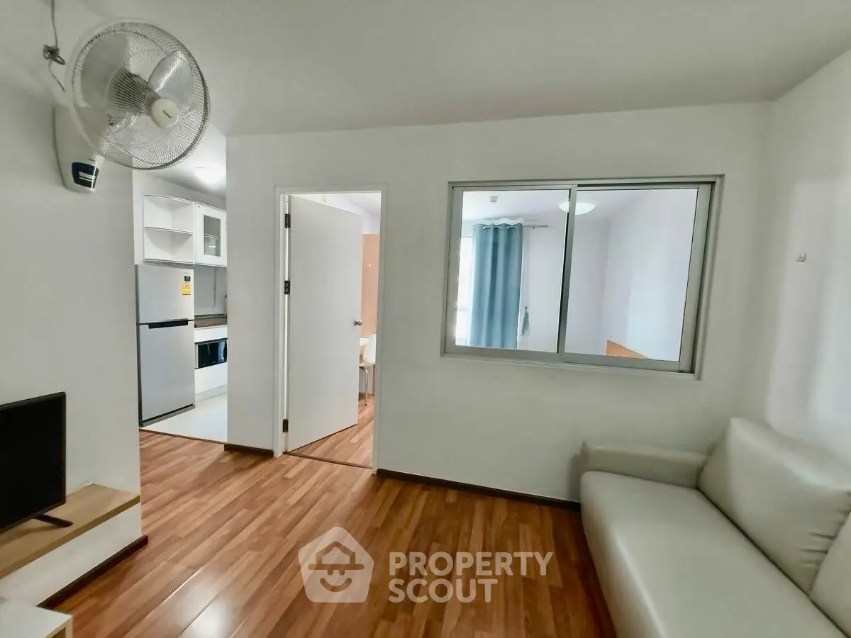 Modern apartment interior with wooden flooring and cozy living area