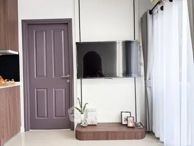 Modern living room with wall-mounted TV and elegant decor