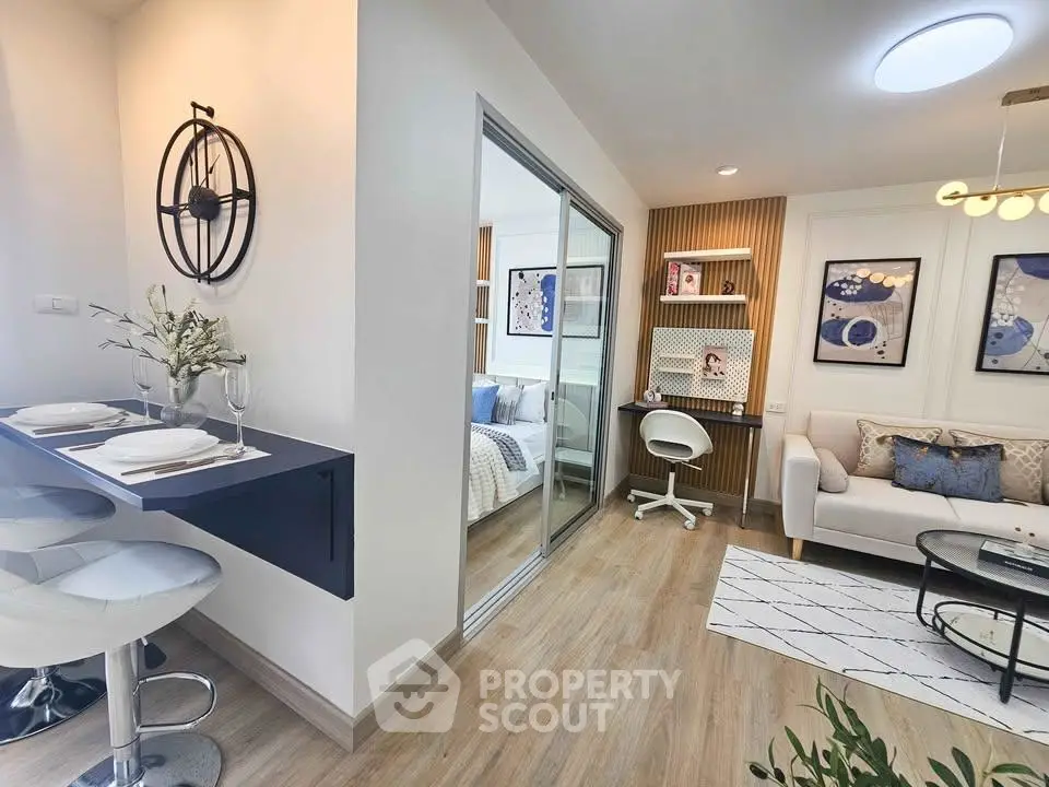 Modern open-plan living room with stylish decor and cozy seating area