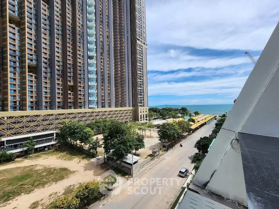 Stunning high-rise building with ocean view, perfect for luxury living by the beach.