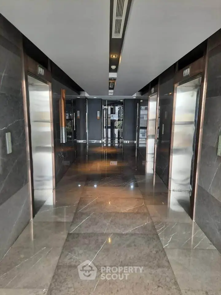 Luxurious marble elevator lobby with modern design and sleek finishes