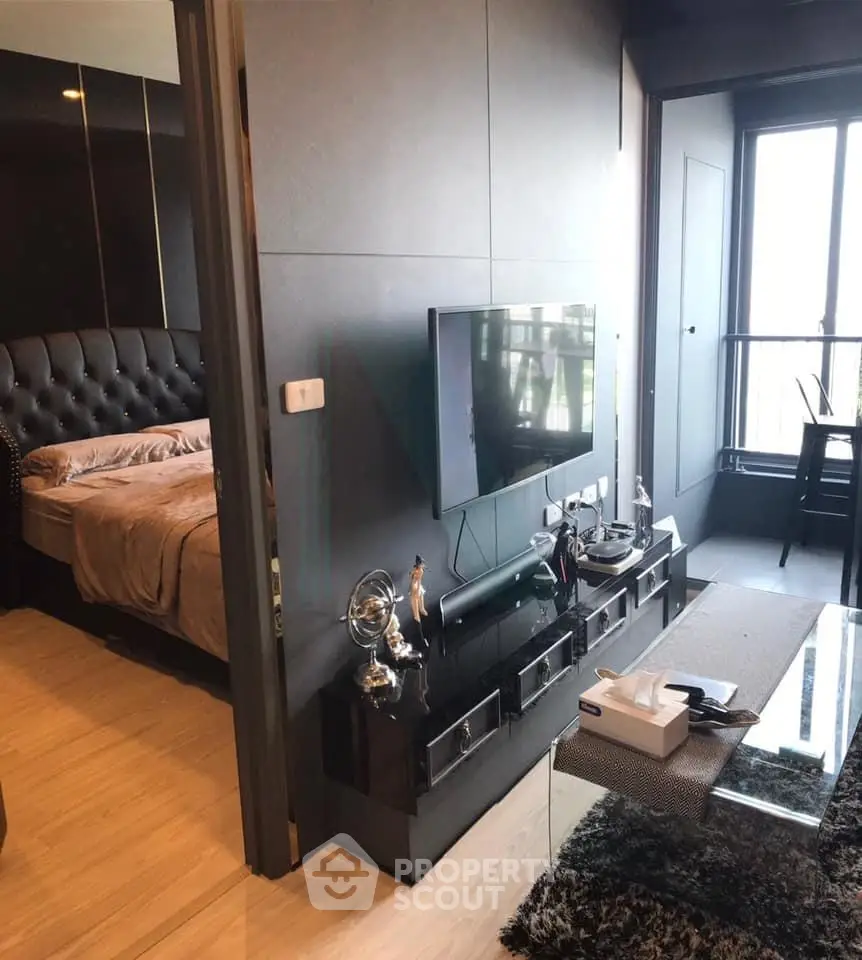 Modern apartment interior with sleek living room and cozy bedroom, featuring stylish decor and natural light.