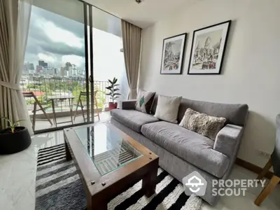 Stylish living room with city view and balcony access, featuring modern decor and comfortable seating.