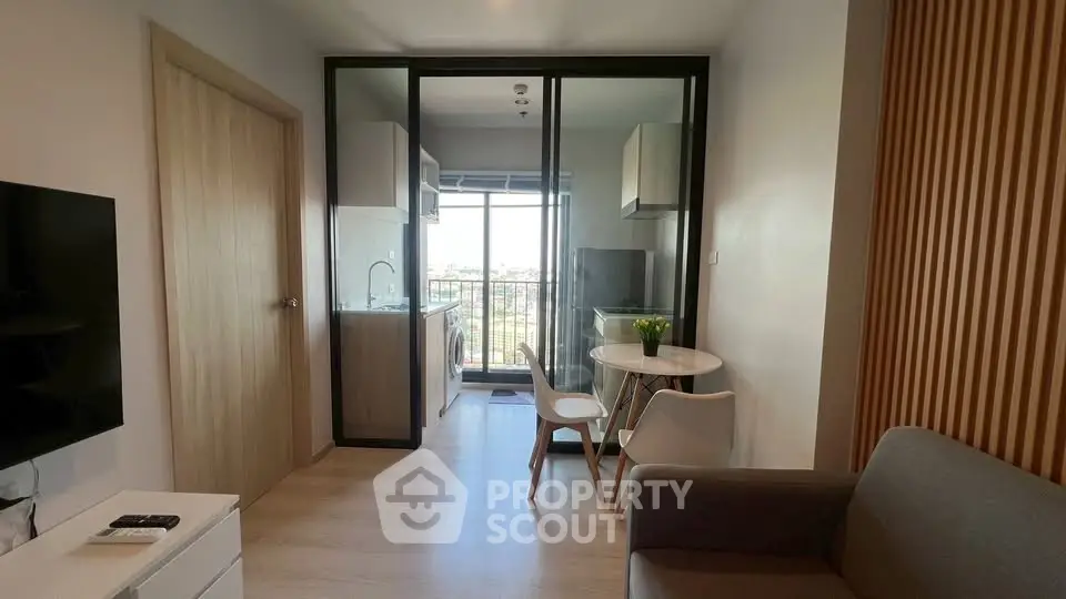 Modern apartment with open kitchen and balcony view