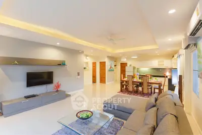 Spacious modern living room with open kitchen and elegant decor