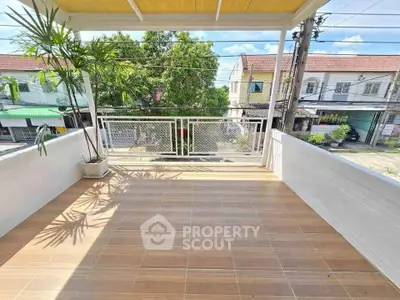 Spacious balcony with tiled flooring and scenic neighborhood view