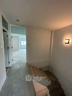 Modern minimalist staircase in a contemporary home with sleek lighting