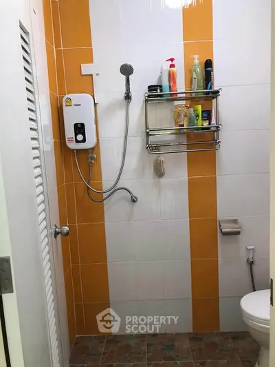 Compact bathroom with shower and toiletries in a modern apartment