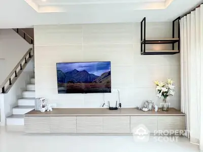 Modern living room with sleek TV setup and elegant decor