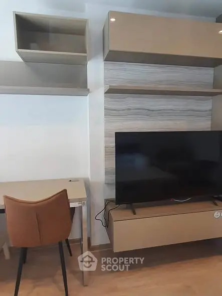 Modern living room with stylish TV unit and workspace