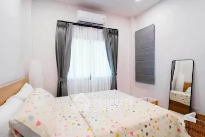 Cozy bedroom with modern decor and natural light