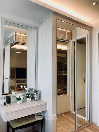 Modern bedroom with mirrored wardrobe and elegant vanity table