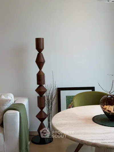 Stylish modern living room with unique wooden sculpture and elegant decor
