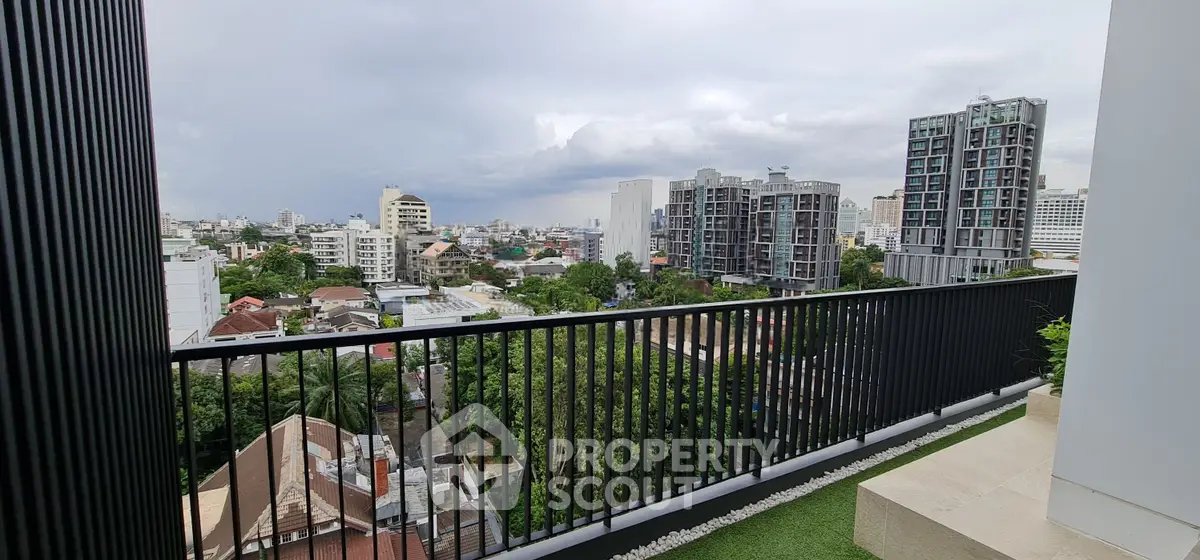 Stunning cityscape view from a modern balcony in a high-rise building, perfect for urban living.