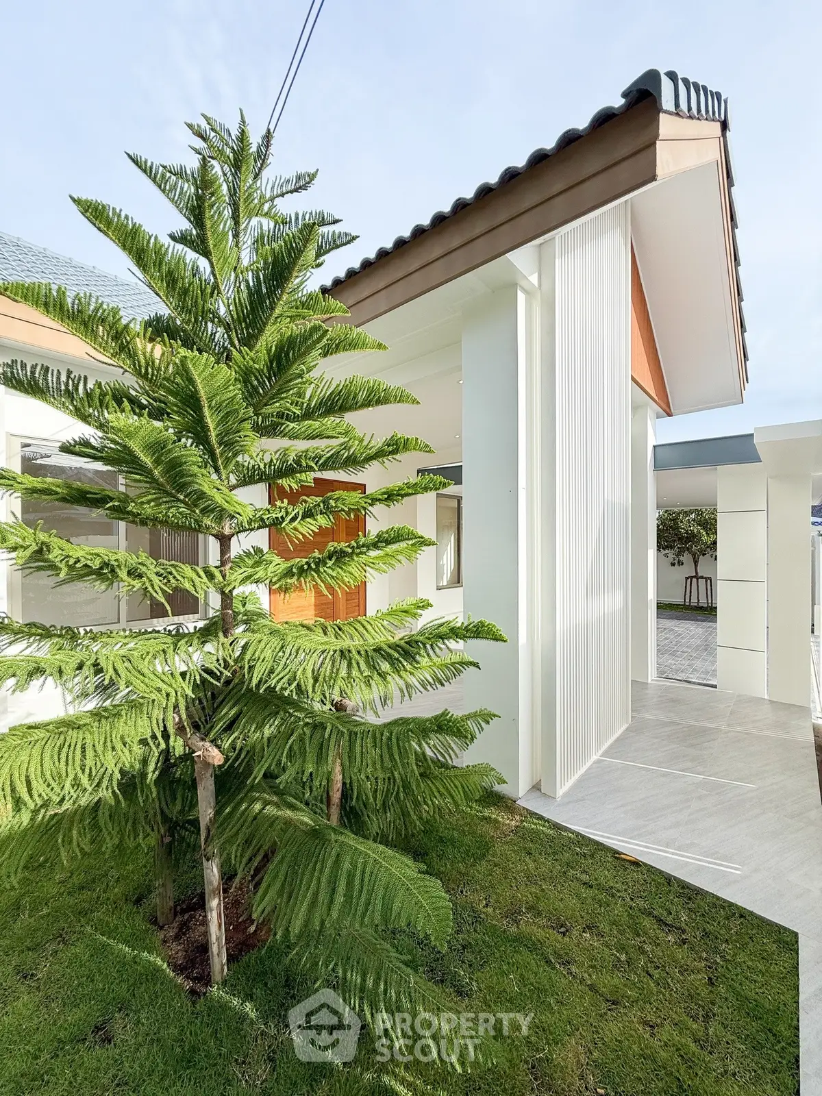 Modern architectural home exterior with lush garden and sleek design