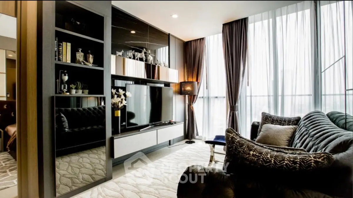 Luxurious modern living room with elegant decor and large windows for natural light.