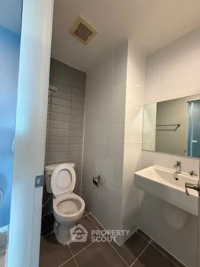 Modern bathroom with sleek tiles and contemporary fixtures