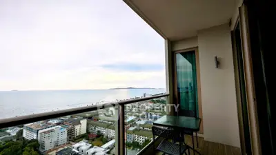 Stunning high-rise balcony with breathtaking ocean view and modern outdoor seating.