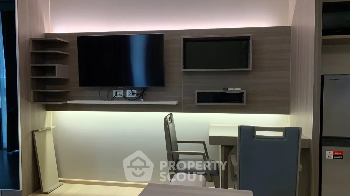 Modern living room with sleek TV setup and stylish furniture