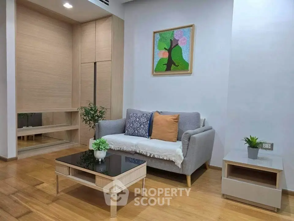 Modern living room with stylish furniture and wooden flooring