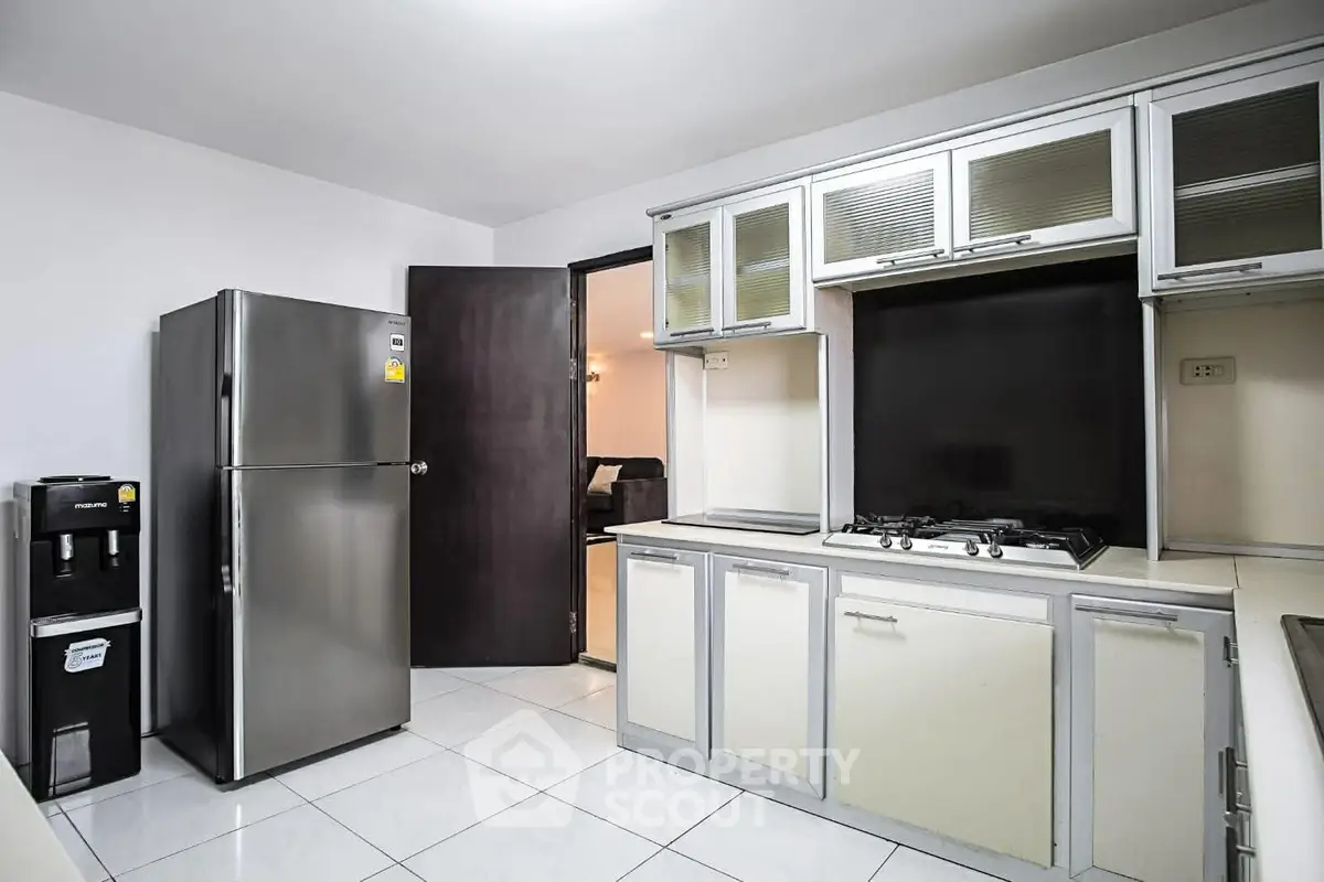Modern kitchen with sleek appliances and gas stove in a contemporary home